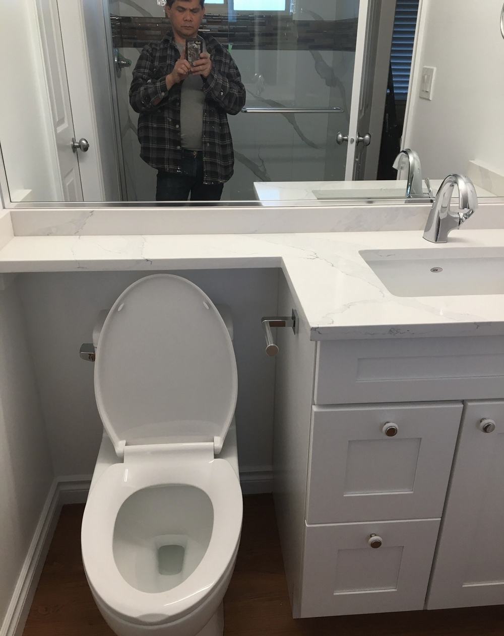Ensuite bathroom renovation with custom vanity and tile work