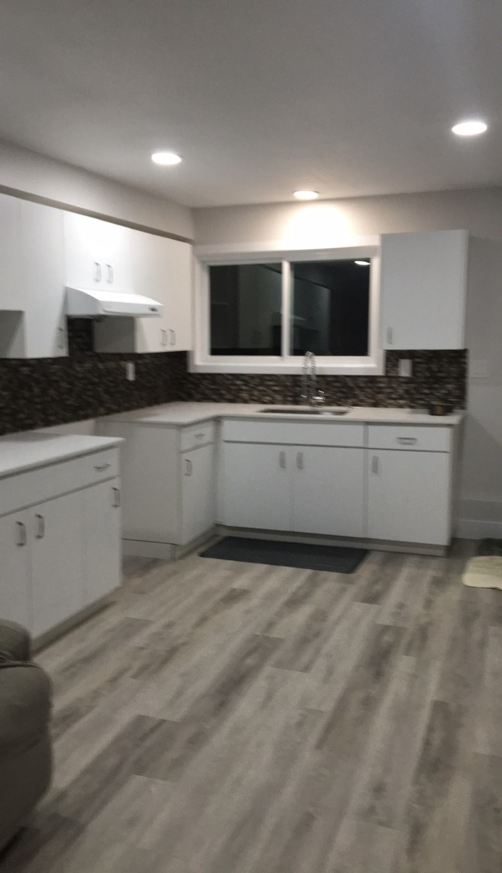 Finished kitchen with new cabinetry and tile backsplash